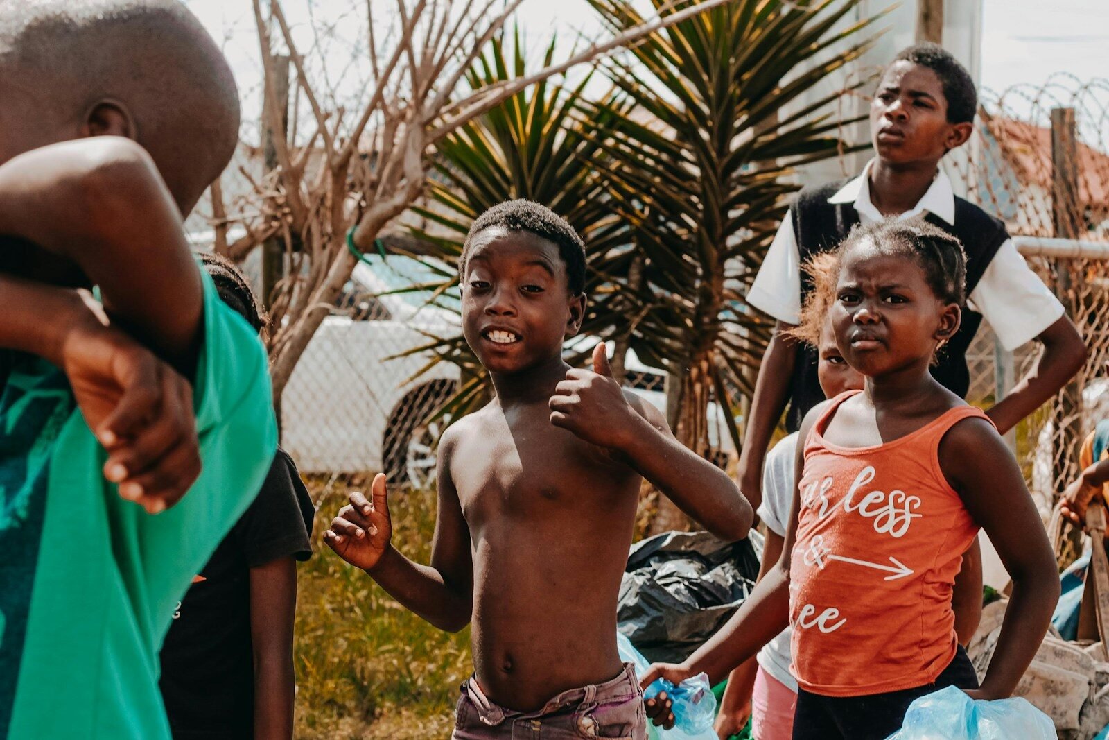 A group of young children standing next to each other